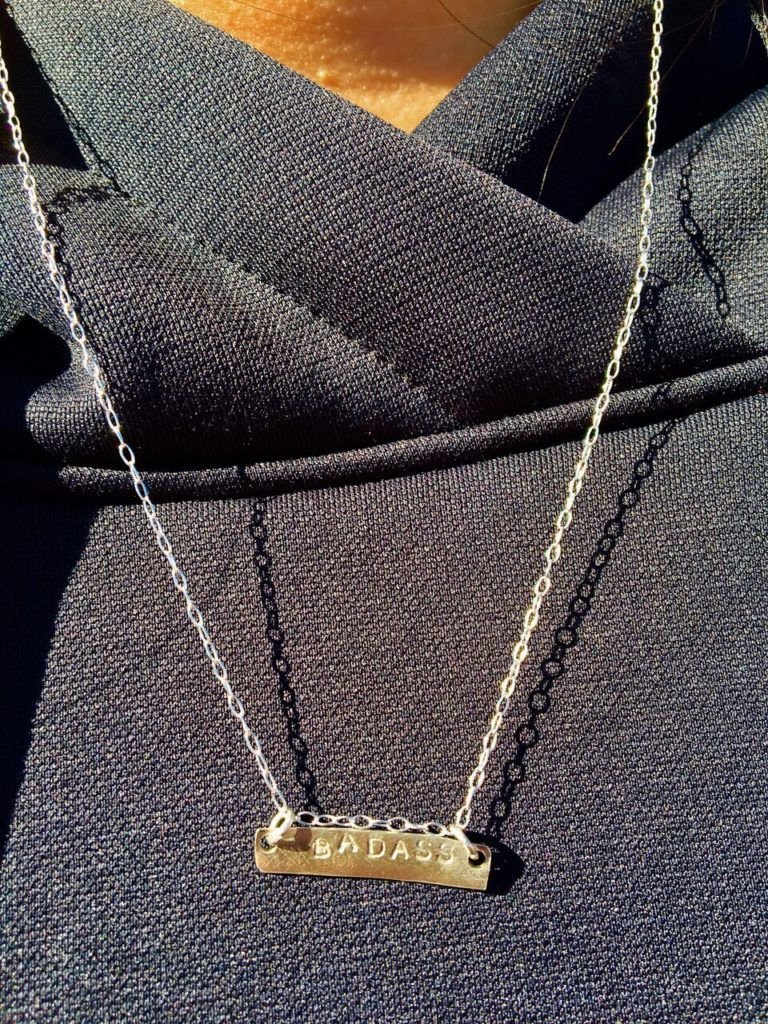 Molly shows off her BADASS necklace.