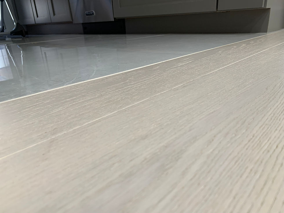 white oak wide hardwood flooring transition into kitchen