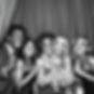 Group of 4_5 black and white people laughing and posing with props at the photo booth.jpg