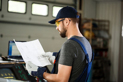 portrait-worker-overalls-steel-factory-background.jpg
