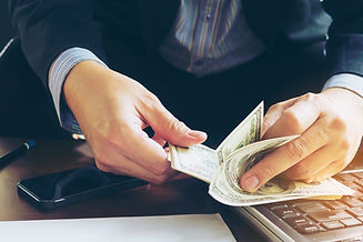 business-man-counting-dollar-banknote-online-business-concept.jpg