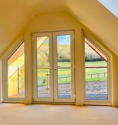 Natural slate roof, larch cladding and flush casement windows ensure the traditional look is maintained, completed in rural Wiltshire, our skilled builders use traditional building methods to ensure we can meet out clients designs.