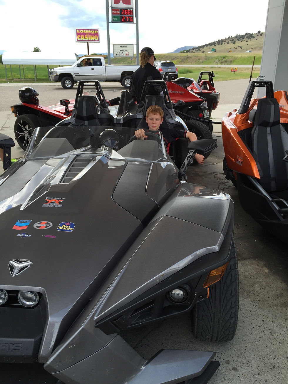 Isaac in a cool car.jpg