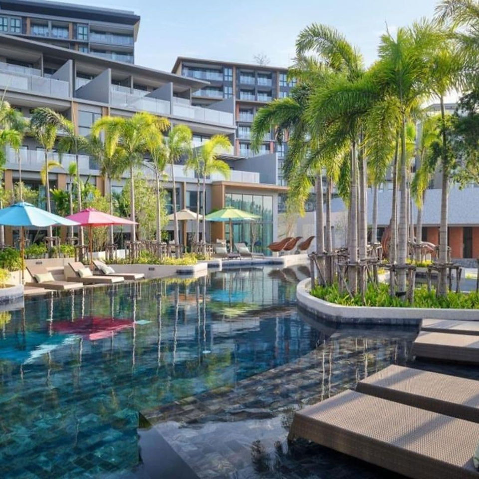 Panorama of the umbrella pool at MIDA Grande Resort Phuket