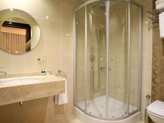 En-suite bathroom — shower cabin and marble finish, Asia City Hotel Istanbul