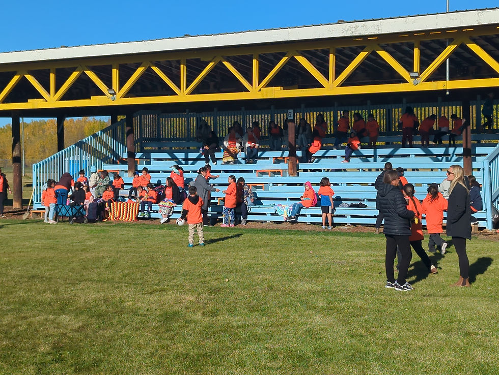 Wide-angle view of a community arbor prepared for a Truth and Reconciliation gathering.