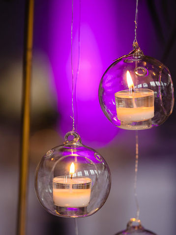 Glass globes with votive candles
