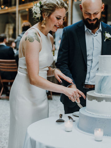 Bride and Groom cutting cake at The hyatt regency Arcade Cleveland Ohio