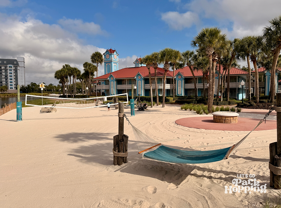 Hammock located near sand volleyball court and fire pit