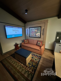 Main room in Fort Wilderness Cabins with sofa that turns into pull down bed