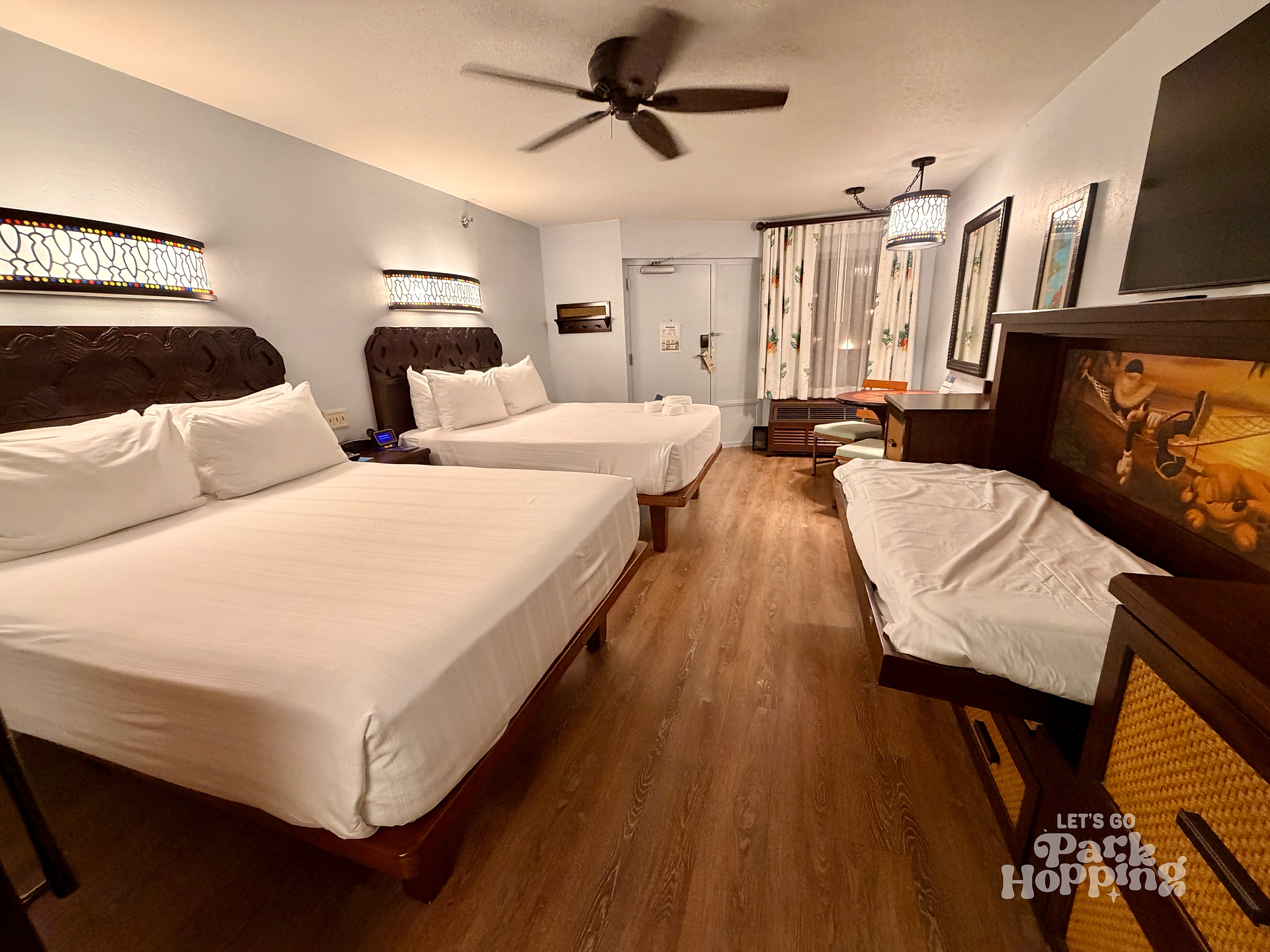 View of Caribbean Beach 5th sleeper room with 2 queen beds and child pull down bed open