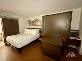 Photo of main room layout with bed and table bed at Disney's All Star Music Resort