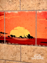 Lion King sunrise artwork in bathroom