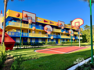 Photo of larger than life basketball court, hoop, and basketballs at All Star Sports Resort