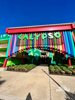 Entrance to the Calypso building at Disney’s All-Star Music Resort at Walt Disney World, with colorful columns and tropical theming.