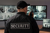 portrait-male-security-guard-with-radio-station-camera-screens (2).jpg