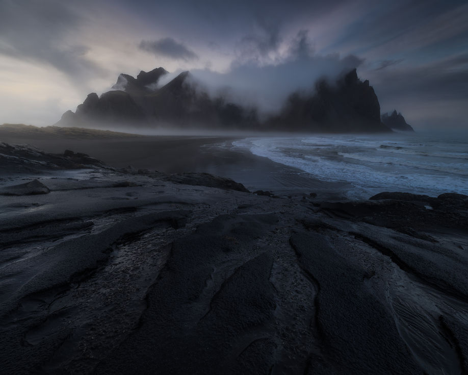 The Vestrahorn mountains in Iceland under the fog.