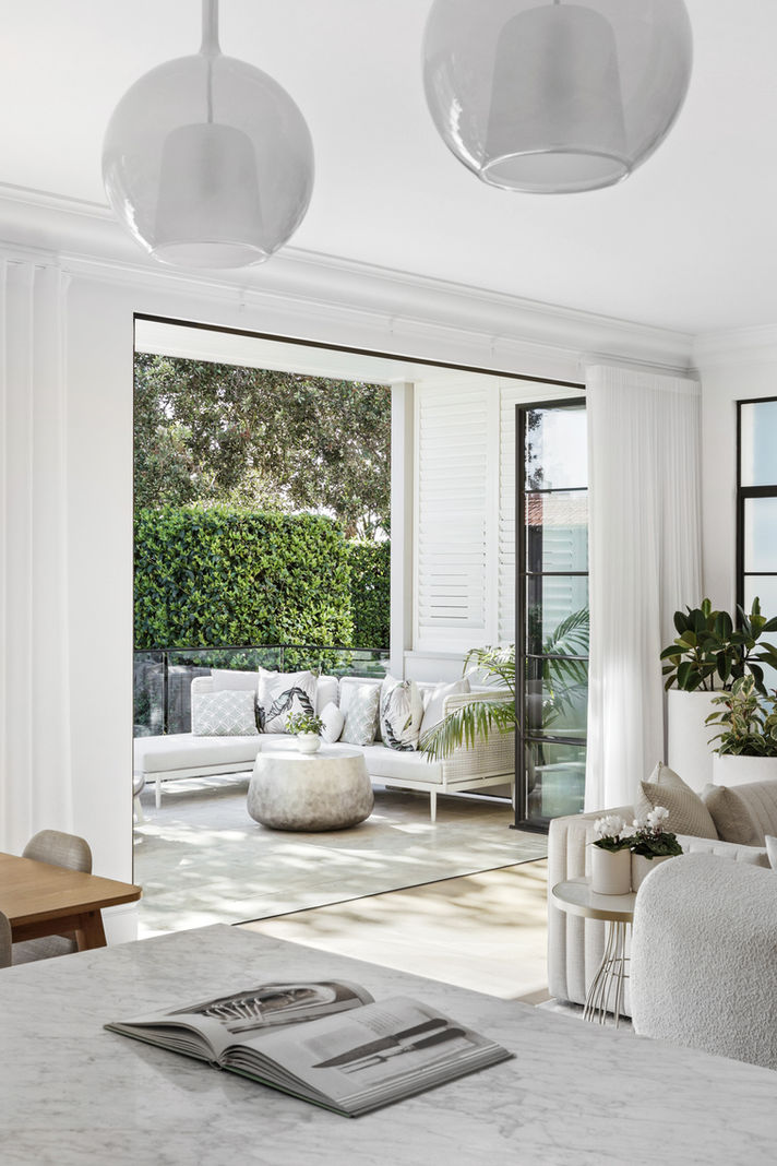 Interior of a luxury apartment featuring a spacious open-plan layout and designer furniture.