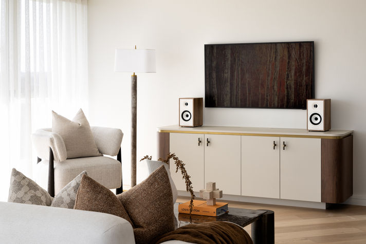 Interior of a stylish apartment in North Sydney, Australia, featuring natural light, modern furnishings, and city views.