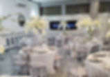 R&R Paradise Banquet Hall with chairs and floral arrangements