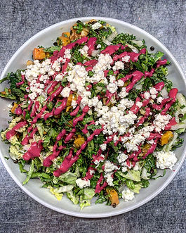 Romi's kale salad with goat cheese, tahini, herbs, and sweet potato