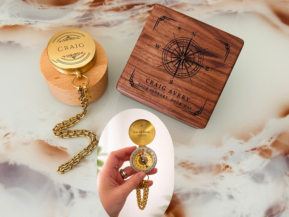 A brass compass with inside engraving next to a wooden gift box with engraved lid