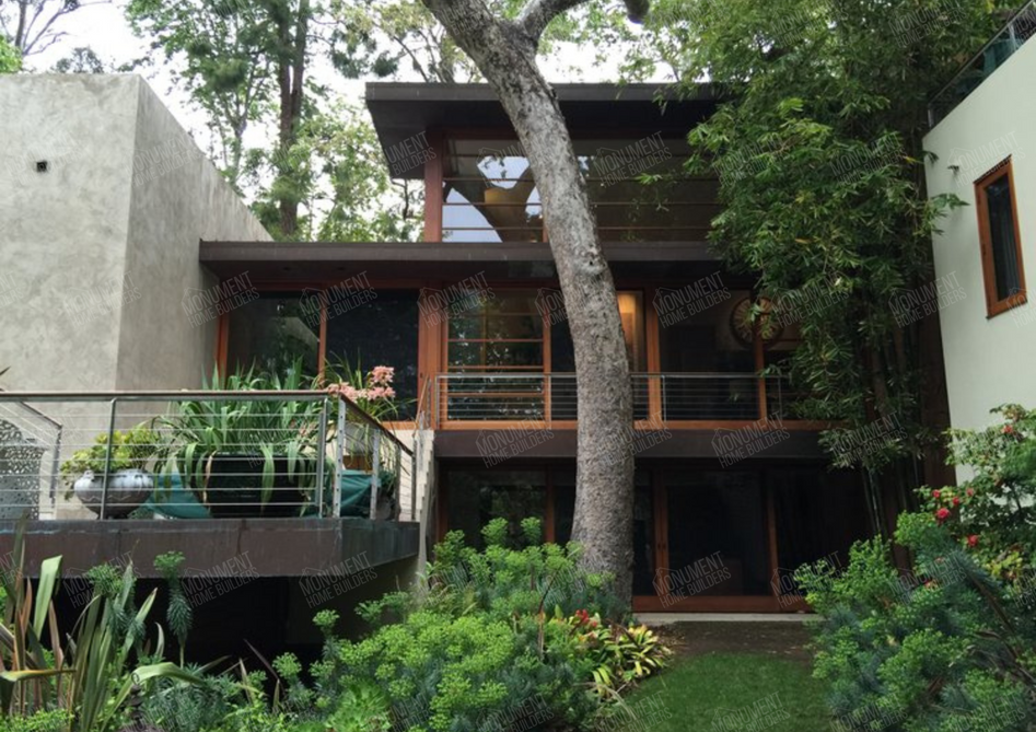 Palisades 2 - Rustic Modern | Monument Home Builders

Outdoor Deck

A spacious wooden deck area nestled among trees, providing a tranquil space for relaxation and outdoor gatherings.