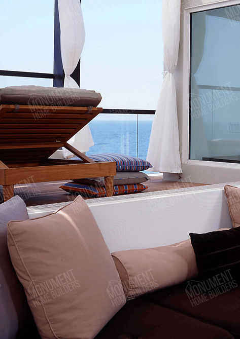 Carbon Beach Epstein Residence | Monument Home Builders
Living room with large windows and seating
A modern living space with large windows, sofas, and scenic views.