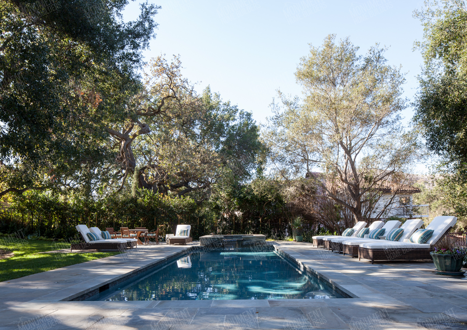 California Traditional | Monument Home Builders
Backyard with pool and lounge chairs
An inviting outdoor pool area with lounge chairs, surrounded by trees and natural scenery.