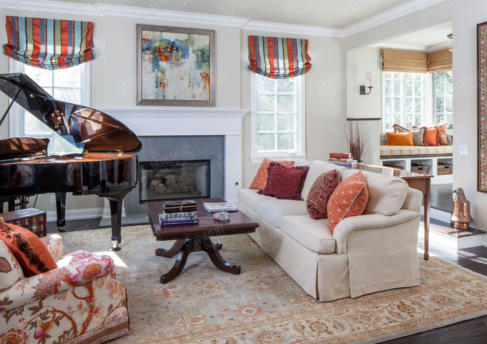 California Traditional | Monument Home Builders
Living room with a grand piano
A charming sitting area with a piano, floral accents, and a cozy atmosphere.