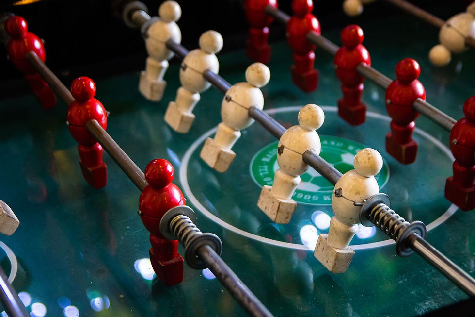 Foosball player figures on the rods