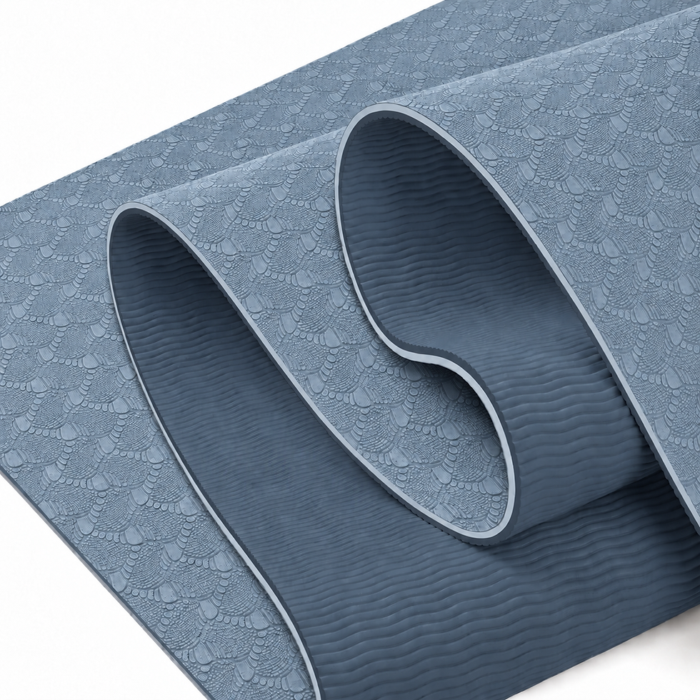 The steel blue TPE yoga mat folded over: embossed light side and ridged deep blue side — TSports Dubai