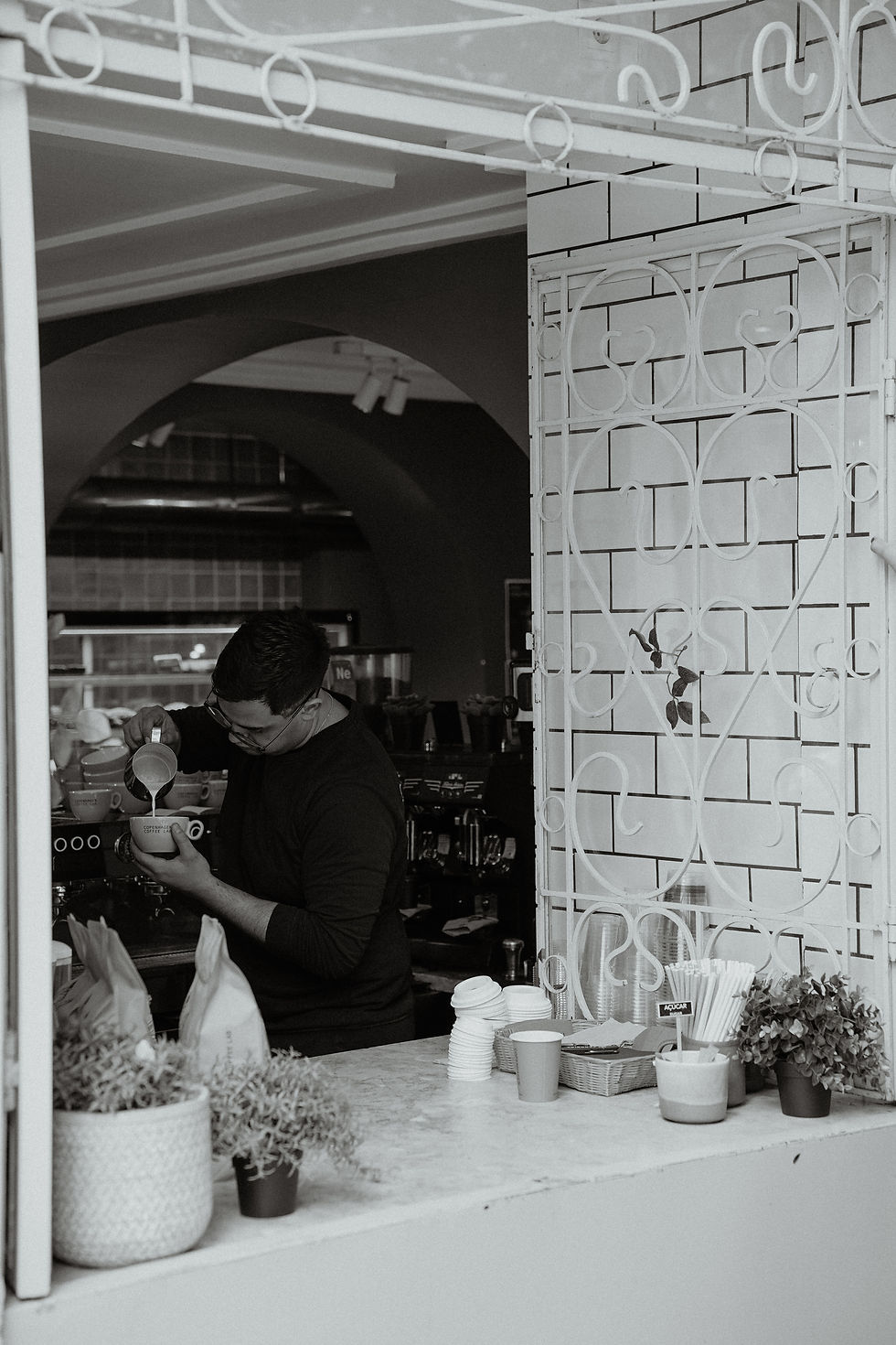 Apetite - Barista preparing coffee drink at modern cafe window - TVS.jpg