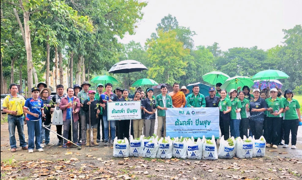 Community members holding seedlings at a tree-planting event