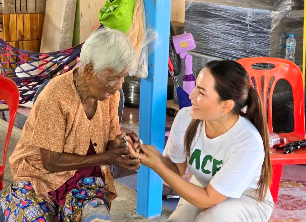 Employee visiting and supporting an elderly community member