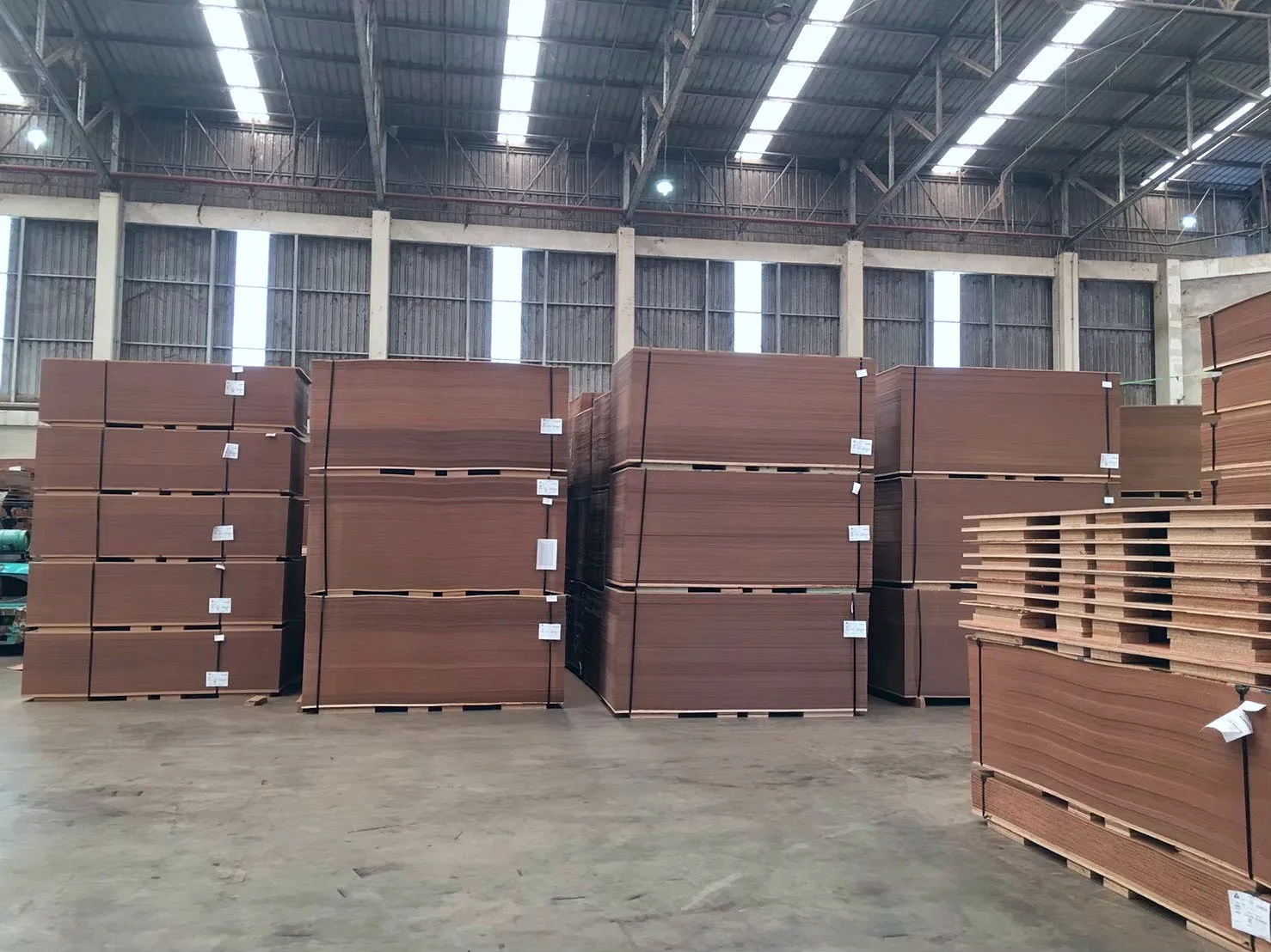 Stacks of finished hardboard in the warehouse