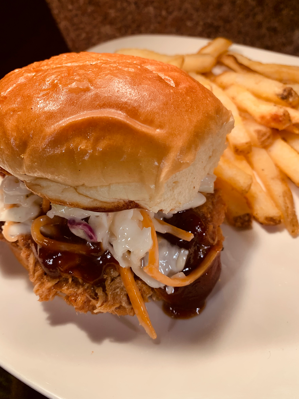 BBQ shredded chicken sandwich with homemade slaw.