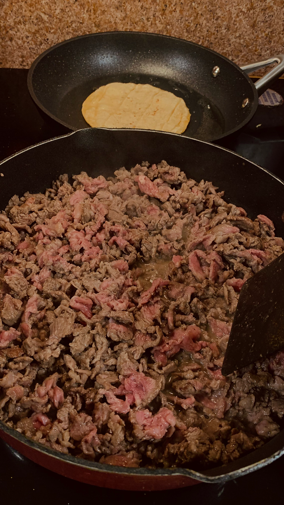 Cooking steak on the stovetop.