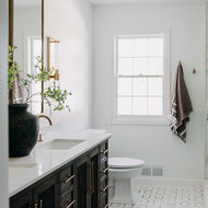 Full bathroom angle showing vanity, window, and shower Bloomfield Hills Michigan primary suite bathroom full view by Costello & Co Construction — women-owned design-build firm