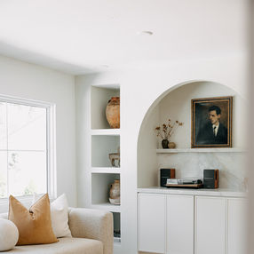 Modern Beverly Hills Michigan living room remodel with arched built-ins
