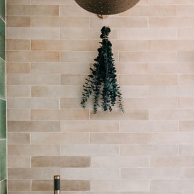 Rain shower head with wood ceiling
Rain shower head against wood plank ceiling — Royal Oak Michigan primary bathroom renovation by Costello & Co Construction Oakland County