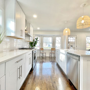 White kitchen renovation with original hardwood floors — Berkley Michigan flip by Costello & Co Construction