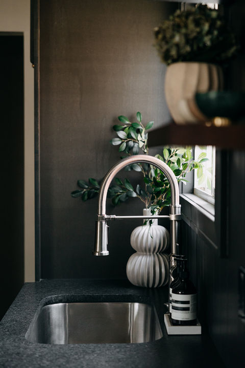 Black quartz countertop and sink with elegant styling. Metro Detroit kitchen remodel