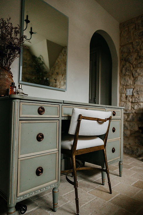 Custom vanity with aged brass fixtures — Birmingham Michigan bathroom renovation by Costello & Co Construction