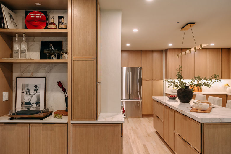 Built-in shelving with vintage record player and sculptural decor.