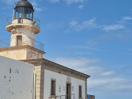 White Cap de Creus lighthouse and lantern tower against a blue sky near Cadaqués in Catalonia