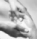pair of hands massaging the palm of another hand.jpg