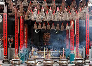 Incense coils burning at traditional Vietnamese temple during Saigon tours spiritual cultural visit