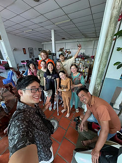 Happy tourists group photo at end of memorable Mekong Delta tour with Saigon Happy Tour team