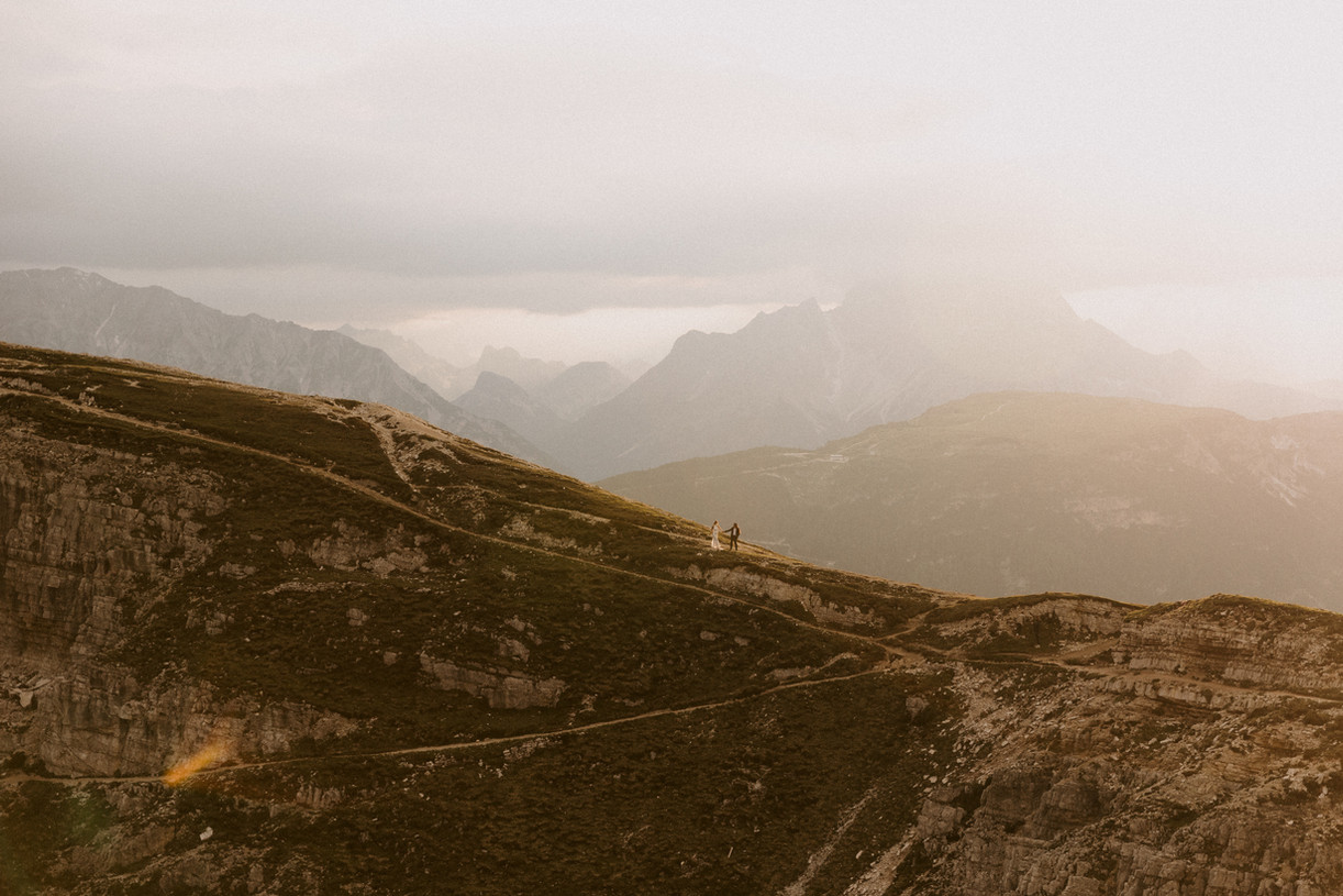 wide shot with bride and groom in the Italian dolomites on their elopement day